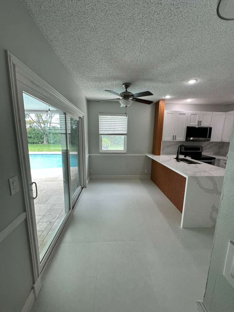 kitchen remodel with white cabinets quartz countertop and pool view Temecula – kitchen remodel portfolio Temecula