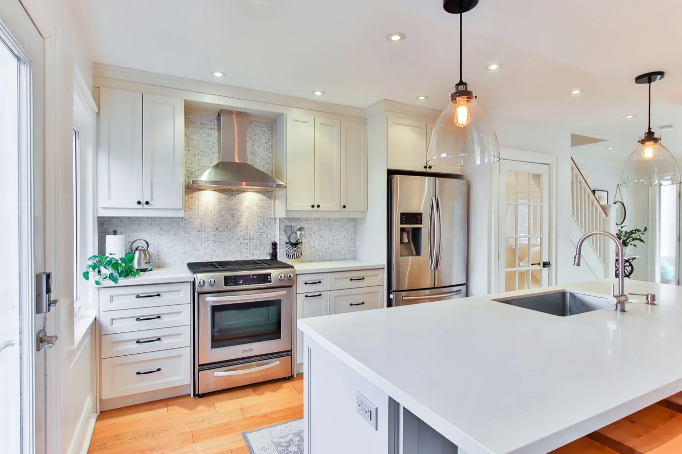 white Shaker kitchen remodel with quartz countertops and stainless appliances – Better World Kitchen Remodeling team Temecula CA